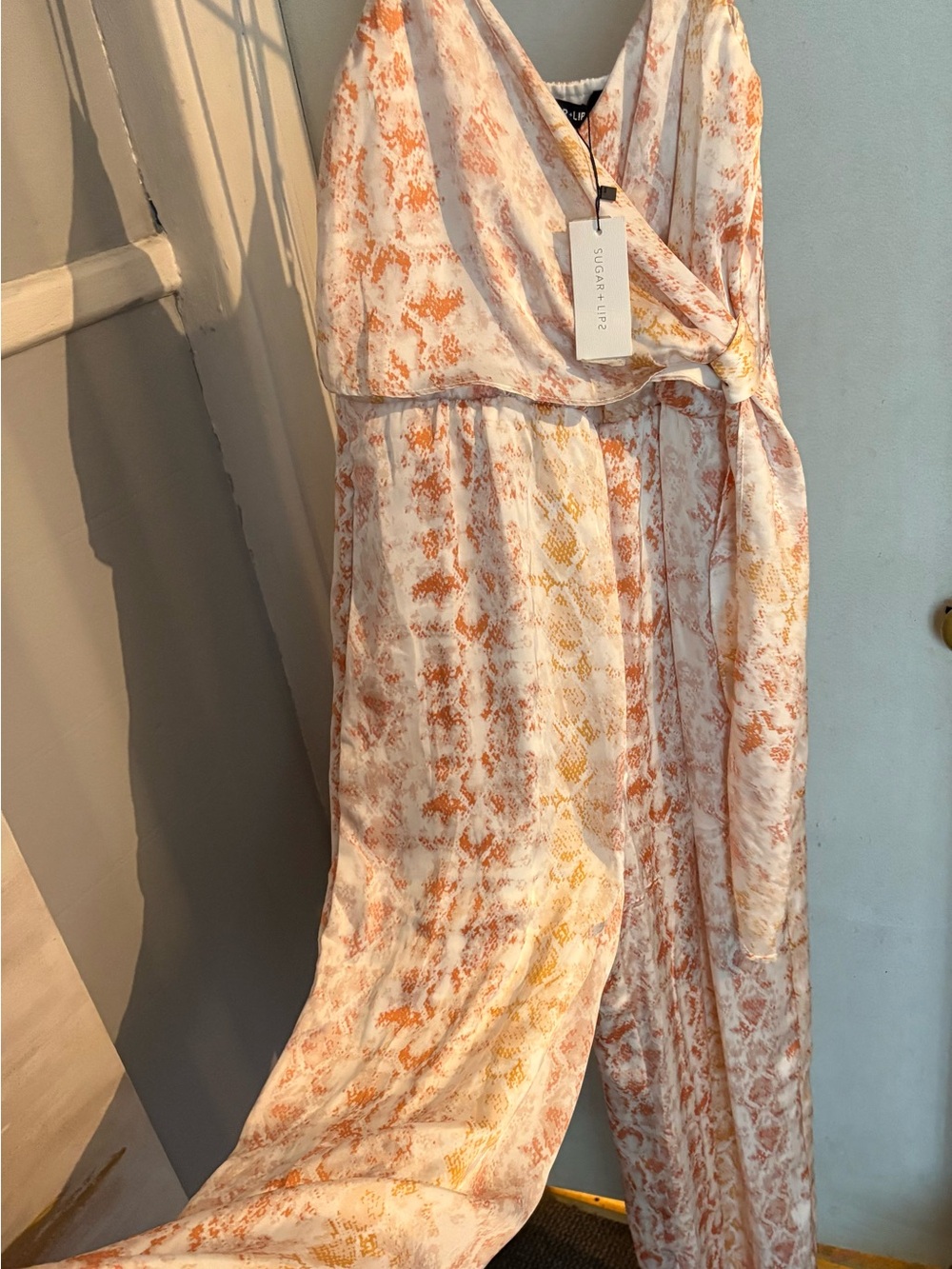Sugarlips Cream Jumpsuit with Orange Print